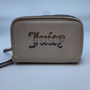 Juicy couture wallet  two zippers places for cards in your ID tan color